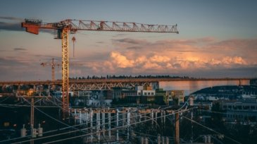 A beautiful view of a construction site in a city during sunset