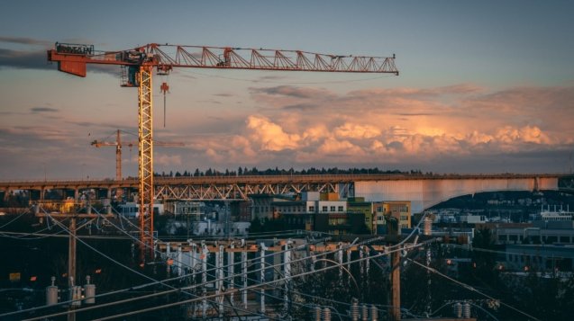 A beautiful view of a construction site in a city during sunset